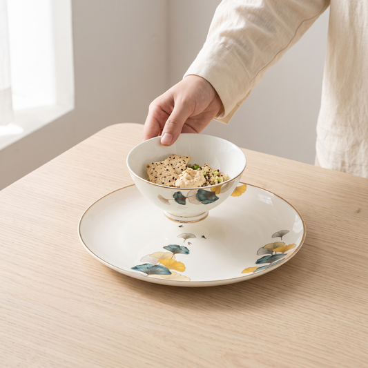 Moonlit Bloom porcelain dinnerware on a pale oak table