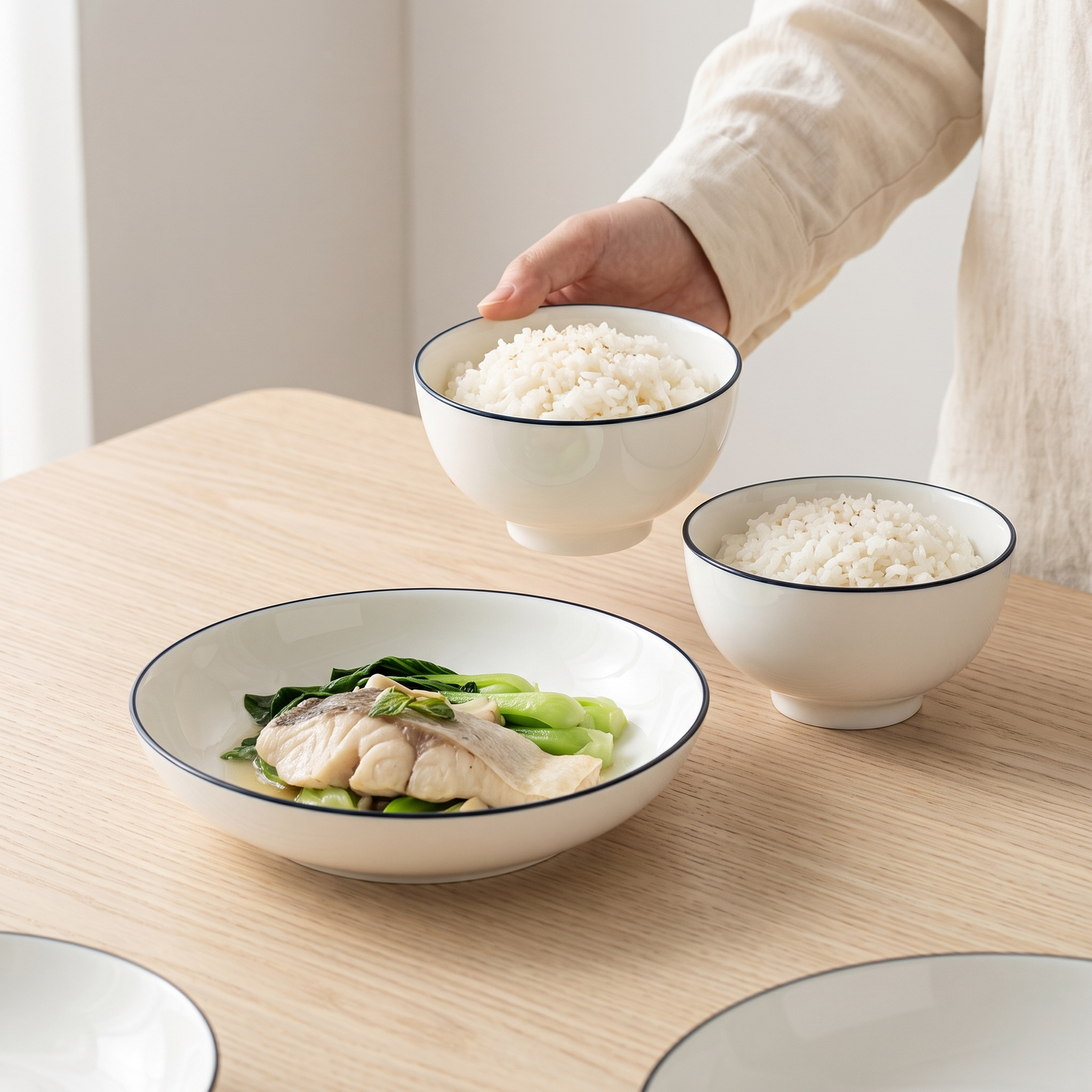 Jingdezhen bone china tableware on a pale oak table